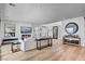 Spacious open-concept living space with bar, fireplace, and modern accents at 472 Windstone Crest Ave, Las Vegas, NV 89138