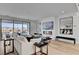 Open-concept living area boasts hardwood floors, a modern fireplace, and a seamless indoor-outdoor flow at 472 Windstone Crest Ave, Las Vegas, NV 89138