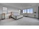 Bright main bedroom boasts large windows and neutral decor, creating a relaxing retreat at 472 Windstone Crest Ave, Las Vegas, NV 89138
