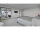 View of main bedroom with a balcony, minimalist furniture, carpet and TV at 472 Windstone Crest Ave, Las Vegas, NV 89138