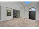 Private patio featuring textured pavers, sleek sliding doors, and a minimalist design at 472 Windstone Crest Ave, Las Vegas, NV 89138