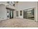 Stylish patio with large sliding doors, neutral color palette, and modern design for outdoor entertaining at 472 Windstone Crest Ave, Las Vegas, NV 89138