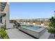 Relaxing pool and spa area with sleek lounge chairs and modern landscaping at 472 Windstone Crest Ave, Las Vegas, NV 89138