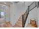 Modern staircase with hardwood floors, metal railings, and bright lighting at 472 Windstone Crest Ave, Las Vegas, NV 89138