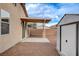 The backyard features a shed, gravel landscaping, and a covered patio at 5033 Wild Buffalo Ave, Las Vegas, NV 89131