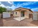 View of the backyard featuring covered patio, shed, and gravel landscaping at 5033 Wild Buffalo Ave, Las Vegas, NV 89131