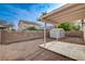 Spacious backyard with gravel, shed, and covered patio, perfect for outdoor entertaining at 5033 Wild Buffalo Ave, Las Vegas, NV 89131