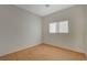 This is a simple bedroom with wood flooring and a window for natural light at 5033 Wild Buffalo Ave, Las Vegas, NV 89131