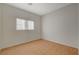 Bedroom featuring wood-look flooring, light colored walls, and a single window at 5033 Wild Buffalo Ave, Las Vegas, NV 89131