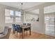 Bright dining area with an open layout into the kitchen and modern chandelier lighting at 5033 Wild Buffalo Ave, Las Vegas, NV 89131
