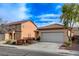 Attractive home with a two-car garage, manicured front yard and desert landscaping in a sunny neighborhood at 5033 Wild Buffalo Ave, Las Vegas, NV 89131