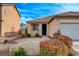 Attractive single-story home with well-maintained front yard, desert landscaping and covered entry at 5033 Wild Buffalo Ave, Las Vegas, NV 89131