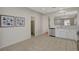 Bright kitchen with stainless steel appliances, white cabinetry, and a pantry at 5033 Wild Buffalo Ave, Las Vegas, NV 89131