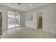 Bright kitchen with stainless steel appliances and sliding glass doors to backyard at 5033 Wild Buffalo Ave, Las Vegas, NV 89131