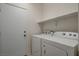 Laundry room featuring washer and dryer and a bright white door at 5033 Wild Buffalo Ave, Las Vegas, NV 89131