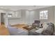 View of the open concept living area featuring large sofa and hardwood floors at 5033 Wild Buffalo Ave, Las Vegas, NV 89131