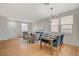 Open concept living and dining area featuring hardwood floors and lots of natural light at 5033 Wild Buffalo Ave, Las Vegas, NV 89131