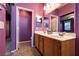 Bathroom with a double sink vanity, tile floor and a view to the Primary bedroom at 5332 Polo Grounds St, Las Vegas, NV 89148