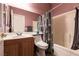 Bathroom with wood vanity, patterned shower curtain, and toilet at 5332 Polo Grounds St, Las Vegas, NV 89148