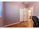 Bedroom featuring hardwood floors, walk-in closet, and natural light at 5332 Polo Grounds St, Las Vegas, NV 89148