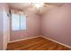 Comfortable bedroom featuring neutral carpet, window with blinds, and a ceiling fan at 5332 Polo Grounds St, Las Vegas, NV 89148