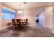A dining area, showing tile flooring, and a view of an adjacent seating area at 5332 Polo Grounds St, Las Vegas, NV 89148
