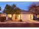 Charming single-story home featuring a well-manicured front yard and an attached two-car garage at 5332 Polo Grounds St, Las Vegas, NV 89148
