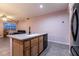 Modern kitchen featuring a central island, stainless steel appliances, and tile flooring at 5332 Polo Grounds St, Las Vegas, NV 89148