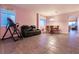 Bright living space with tile floors and a dining set for a welcoming atmosphere at 5332 Polo Grounds St, Las Vegas, NV 89148