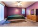 Spacious bedroom with plush carpet, ceiling fan, and an expansive mirrored dresser at 5332 Polo Grounds St, Las Vegas, NV 89148