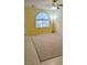 Spacious carpeted living room with a ceiling fan and a large window at 6339 Sharp Rock Ct, Las Vegas, NV 89139