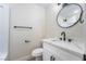 Modern bathroom with a white vanity, elegant sink fixtures, toilet, and shower at 6425 Evergreen Ave, Las Vegas, NV 89107