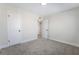 Inviting carpeted bedroom with white trim, a view to another room, and closet at 6425 Evergreen Ave, Las Vegas, NV 89107