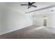 Bright bedroom featuring modern ceiling fan, neutral paint, carpet, and baseboards at 6425 Evergreen Ave, Las Vegas, NV 89107
