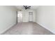 Spacious bedroom featuring neutral walls, carpet, closet, and modern ceiling fan at 6425 Evergreen Ave, Las Vegas, NV 89107