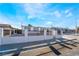 Single-story home showcasing a secure, white-walled gated front yard in a residential area at 6425 Evergreen Ave, Las Vegas, NV 89107