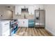 Updated kitchen featuring stainless steel appliances and bright blue dishwasher at 6425 Evergreen Ave, Las Vegas, NV 89107