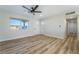 The bright living room showcases new floors, a ceiling fan, and fresh paint at 6425 Evergreen Ave, Las Vegas, NV 89107