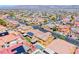 Aerial view of a new residential community with mountain views on a sunny day at 6617 Fort William St, North Las Vegas, NV 89084