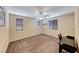 Simple bedroom with carpet, natural light, and a desk providing a quiet and comfortable atmosphere at 6617 Fort William St, North Las Vegas, NV 89084
