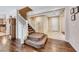Inviting foyer boasts tile flooring, a grand staircase, and a view into the adjacent kitchen at 6617 Fort William St, North Las Vegas, NV 89084