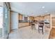 Eat-in kitchen with maple cabinets, granite countertops, stainless steel appliances, and tile floors at 6617 Fort William St, North Las Vegas, NV 89084