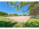 Sand volleyball court surrounded by lush greenery and open skies at 6617 Fort William St, North Las Vegas, NV 89084