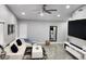 Bright living room featuring a modern sofa, tiled floors, contemporary decor and recessed lighting at 7091 Rhapsody Ln, Las Vegas, NV 89119