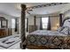 This bedroom includes two dressers, and a four-poster bed at 712 Monroe Hill Pl, Henderson, NV 89011