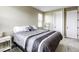 Well-lit bedroom featuring carpet, large bed, and ample natural light at 712 Monroe Hill Pl, Henderson, NV 89011