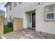 Charming front entrance with a black door, brick accent wall, and well-maintained landscaping at 712 Monroe Hill Pl, Henderson, NV 89011