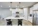 Bright modern kitchen features a large center island with bar stool seating at 712 Monroe Hill Pl, Henderson, NV 89011