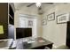 Close up of a home office with a large monitor on a dark wood desk at 712 Monroe Hill Pl, Henderson, NV 89011