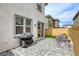 Private backyard patio with pavers, grill, and artificial turf at 712 Monroe Hill Pl, Henderson, NV 89011
